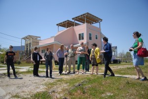 The tour group with John Williams (center) standing in front of the Frank Gehry- designed Lower Ninth Ward residence. Photo by author.