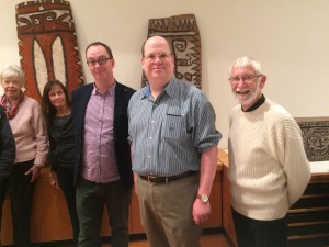  Eric Kjellgren with Pacific Art Curator Crispin Howarth (left in navy blue blazer) and members of the Oceanic Art Society examining works at the National Gallery of Australia