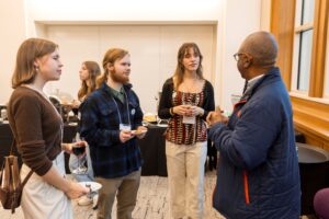 people talking to each other at an event