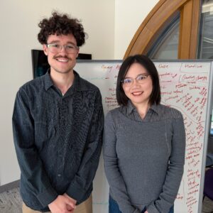Dr. Yayu Feng and eMedia student Kevin Lynch are posting for a photo
