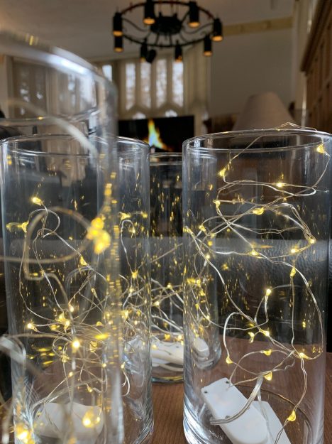photo of clear vases filled with small LED lights