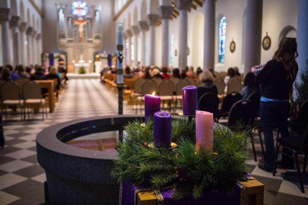 Advent wreath with 4 Advent candles and Saint Mary's Chapel in the background