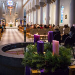 Advent wreath with 4 Advent candles and Saint Mary's Chapel in the background