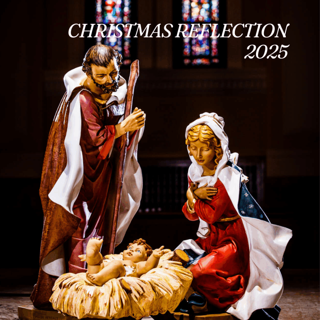 Close-up of Joseph standing with a staff and Mary kneeling beside baby Jesus in a manger. Warm light shines on the figures, and stained-glass windows glow softly in the background. Text reads “Christmas Reflection 2025.”